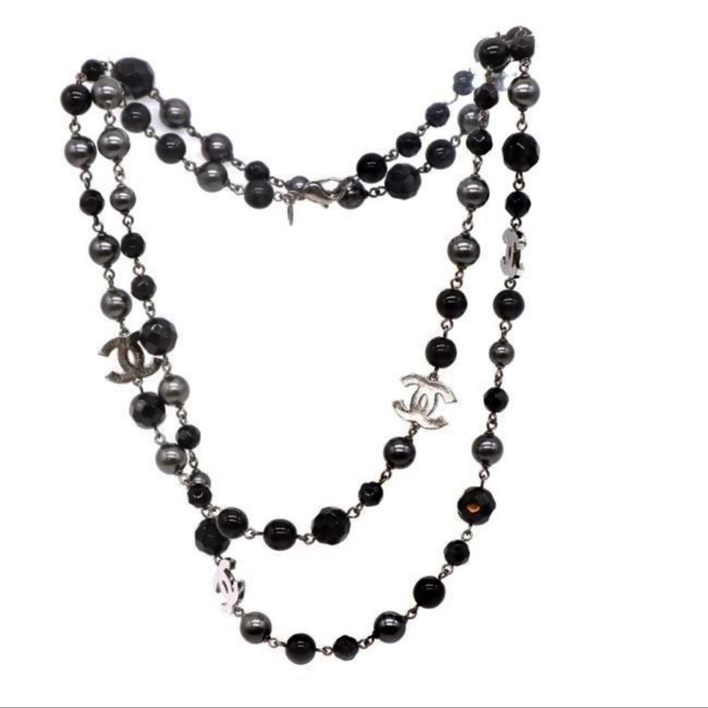 Chanel black pearl necklace.